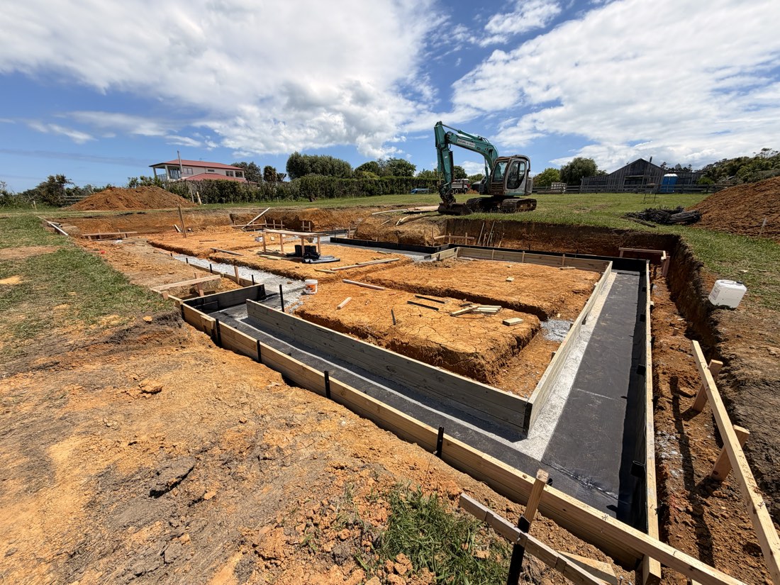 Tanking membrane applied to foundation walls in an open excavation