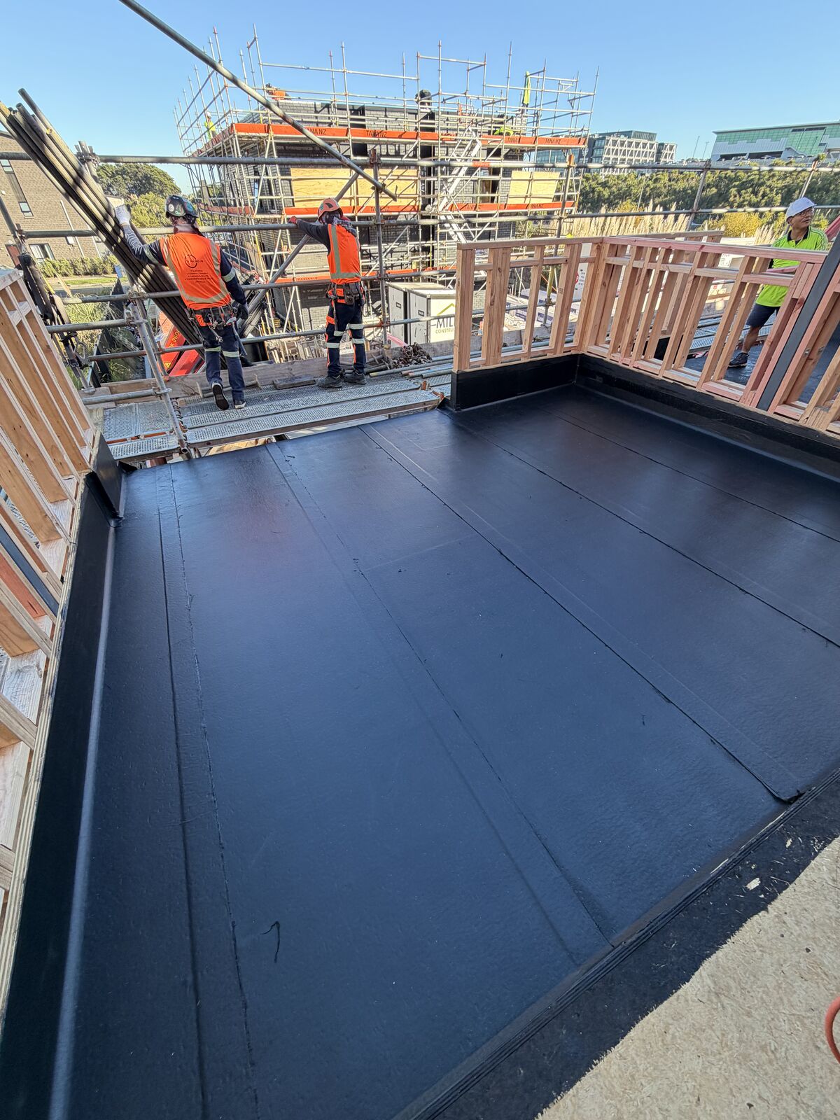Torch-on waterproofing Manukau — Nuraply 3PM membrane installed on a new build deck with timber balustrade