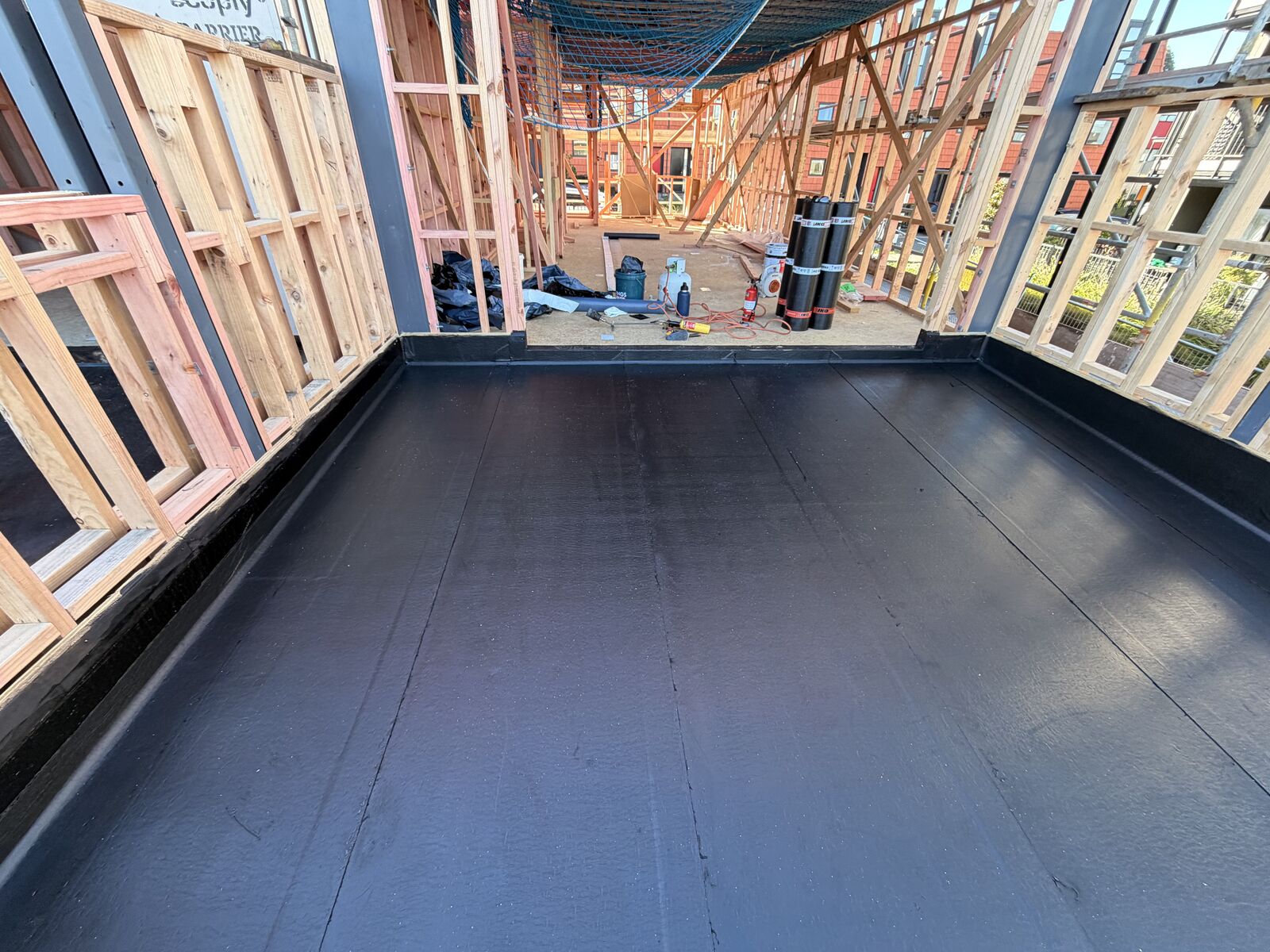 Torch-on waterproofing Manukau — double-layer Nuraply 3PM membrane over new build deck substrate