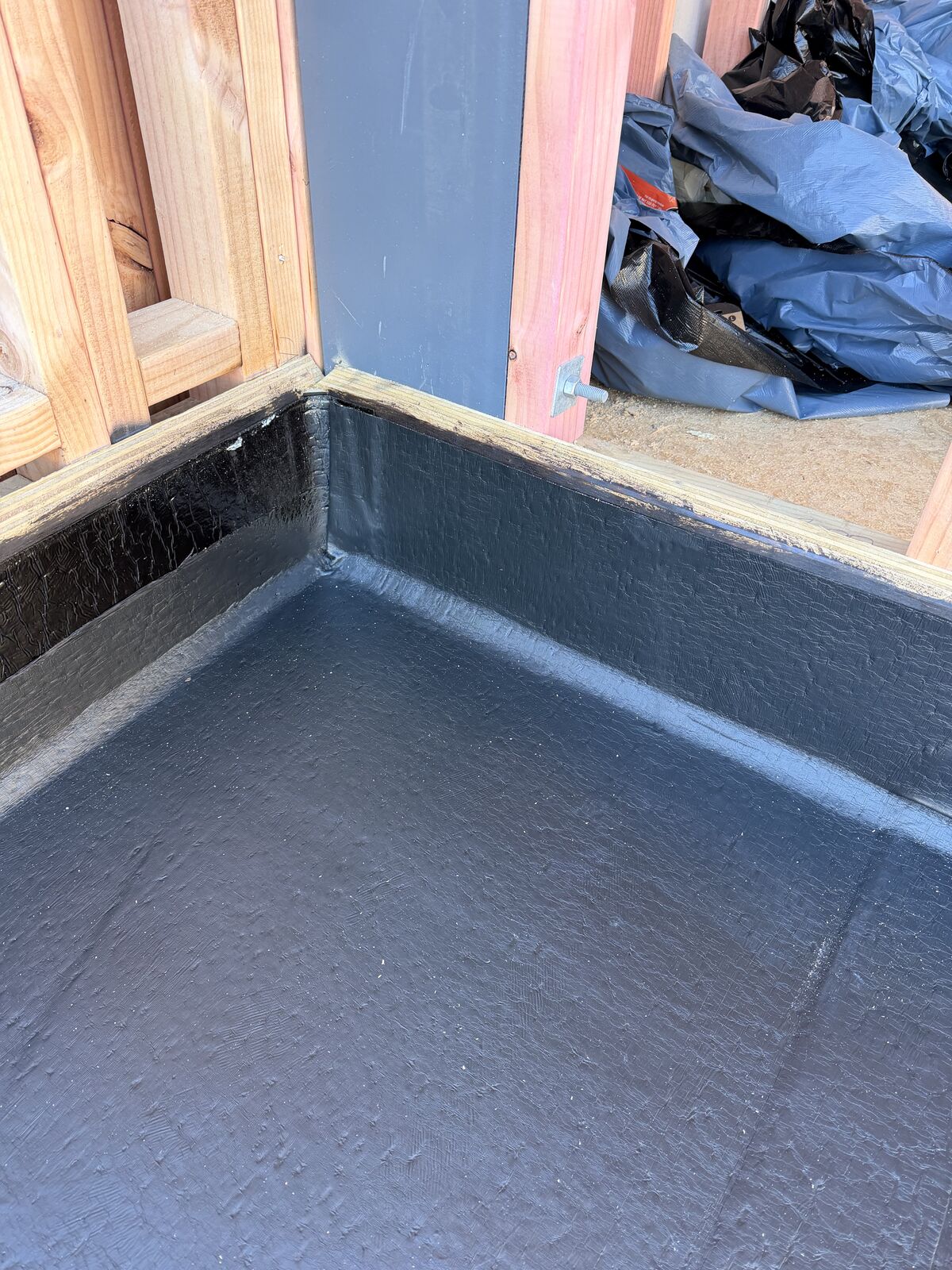 Torch-on waterproofing Manukau — Nuralite Nuraply 3PM upstand detailing at wall junction